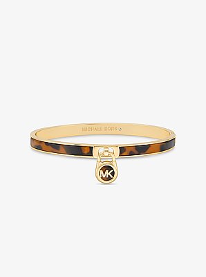 Pulsera r&iacute;gida chapada en oro con detalles de carey y dije de candado