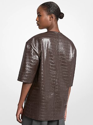Top de piel con relieve de cocodrilo