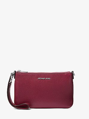 Petite pochette-bracelet Jet Set convertible en cuir grain&eacute;