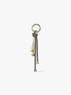 Colgante para bolso con cord&oacute;n en tono dorado y motas