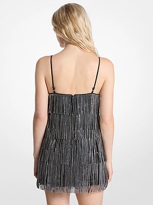 Vestido lencero con tachuelas y flecos