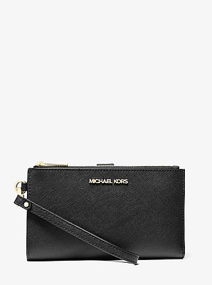 Cartera Jet Set grande de piel con tira de mu&ntilde;eca y compartimento para smartphone