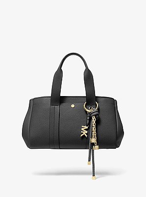 Breloque pour sac de ton or avec cordon mouchet&eacute;
