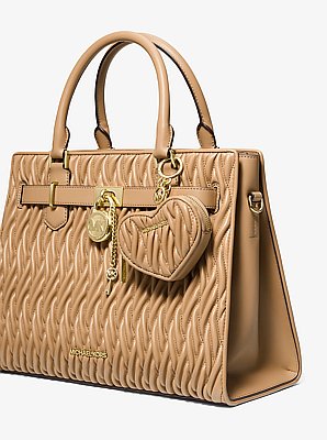 Porte-monnaie Jet Set Travel matelass&eacute; en forme de c&oelig;ur