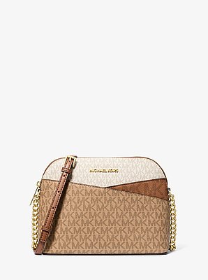Bolso cruzado Jet Set Travel mediano con bloques de color y logotipo de la marca
