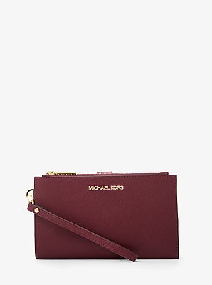 Cartera Jet Set grande de piel con tira de mu&ntilde;eca y compartimento para smartphone image number 0