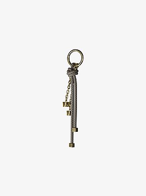 Colgante para bolso con cord&oacute;n en tono dorado y motas