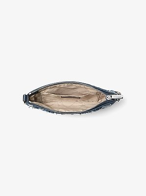 Petite pochette-bracelet convertible Jet Set Travel en denim &agrave; motif patchwork
