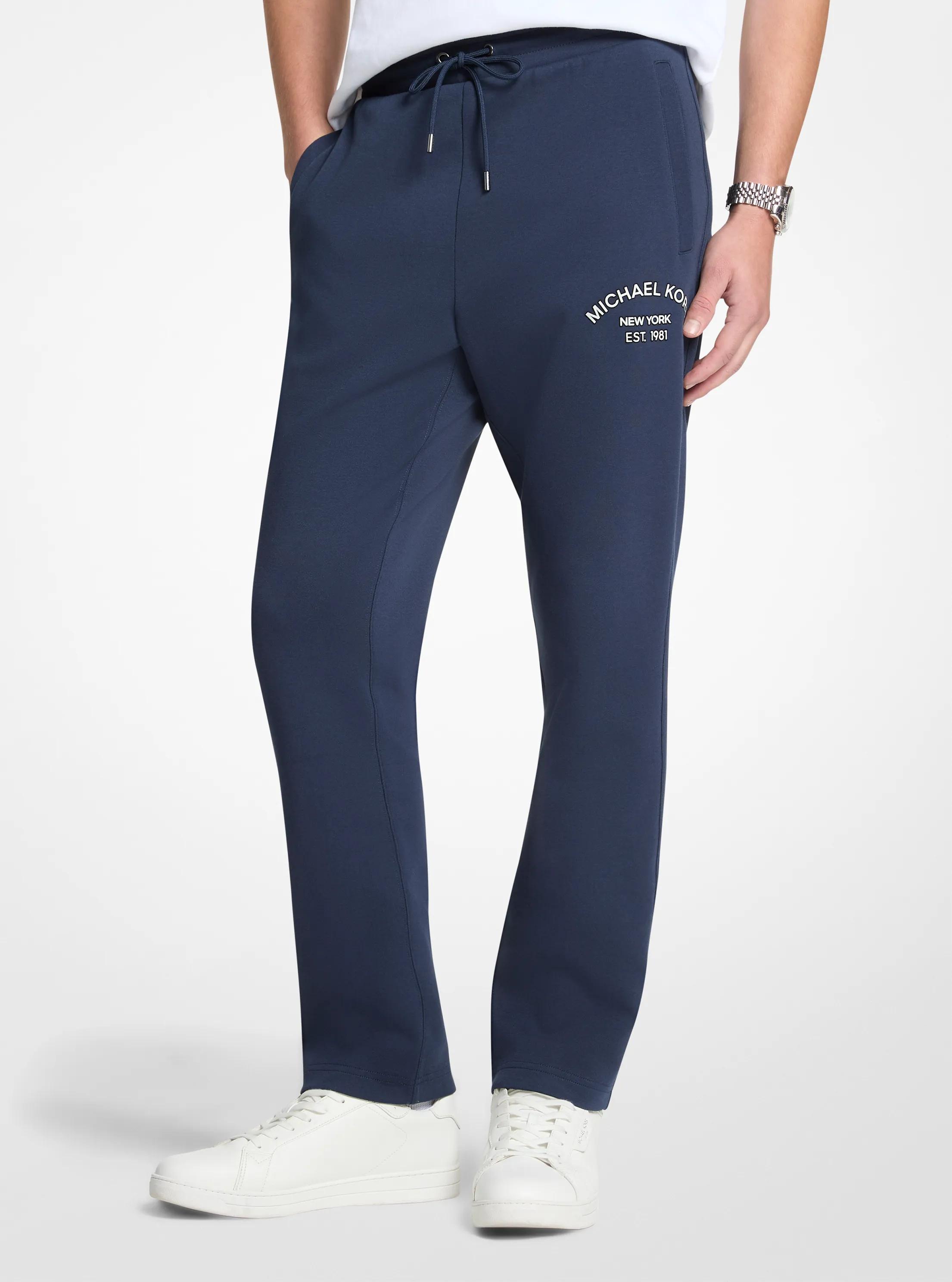 Pantalon tricot en m&eacute;lange de coton &agrave; logo in MINUIT | Michael Kors